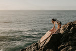 Load image into Gallery viewer, Girl laying rug over some rocks at the beach
